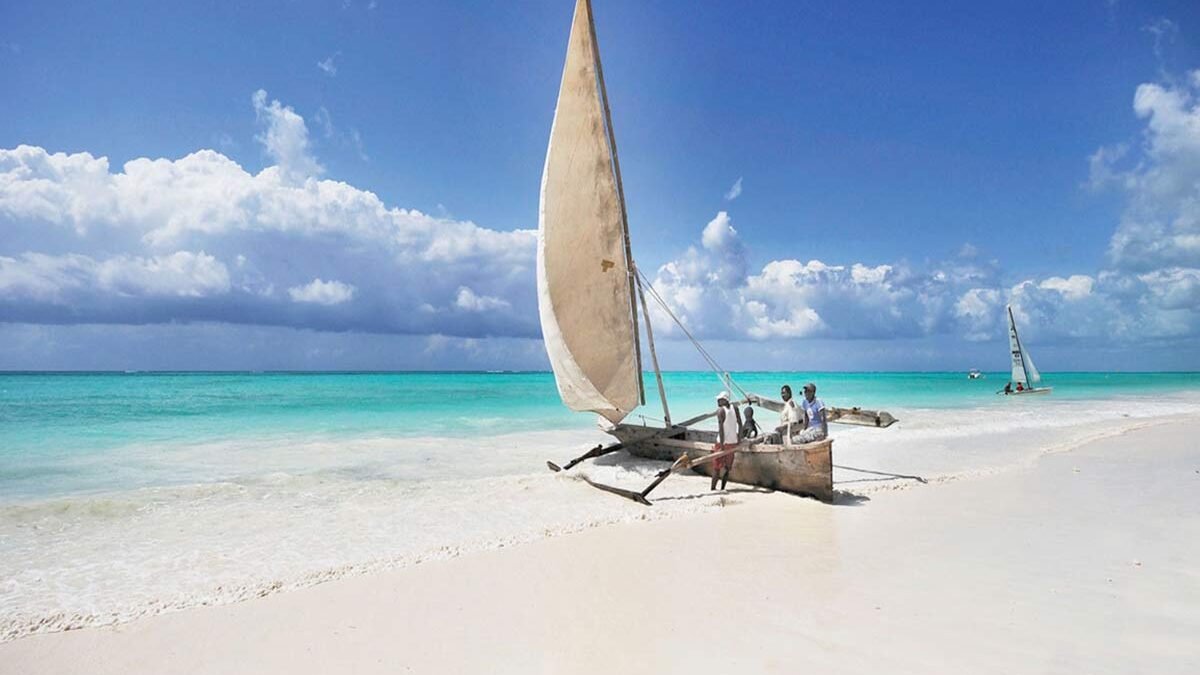 Pristine white sand beach with turquoise Indian Ocean waters on the coast of Zanzibar
