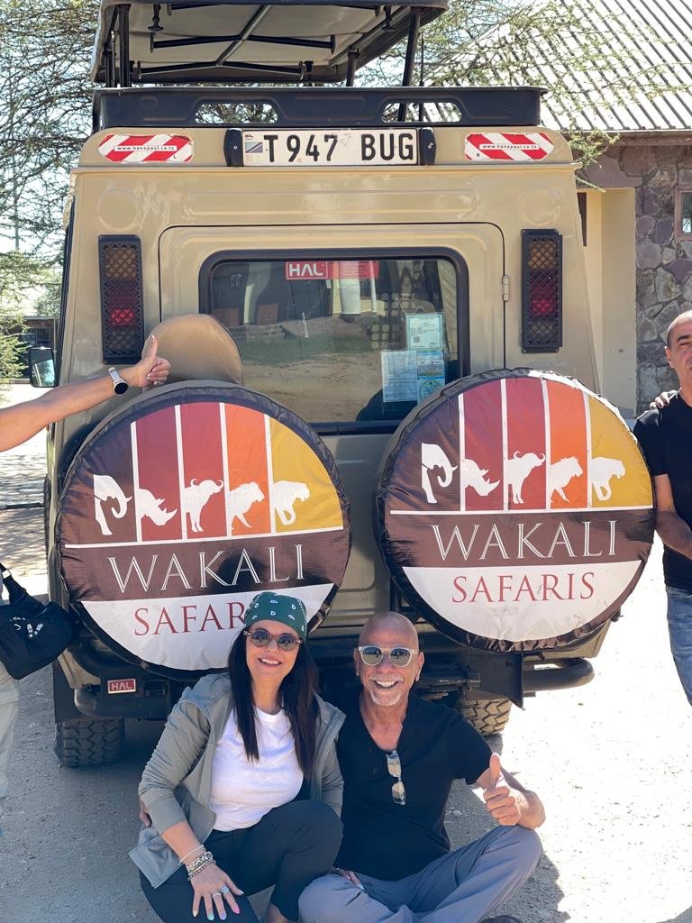 Happy Wakali Safaris guests posing together after a safari adventure