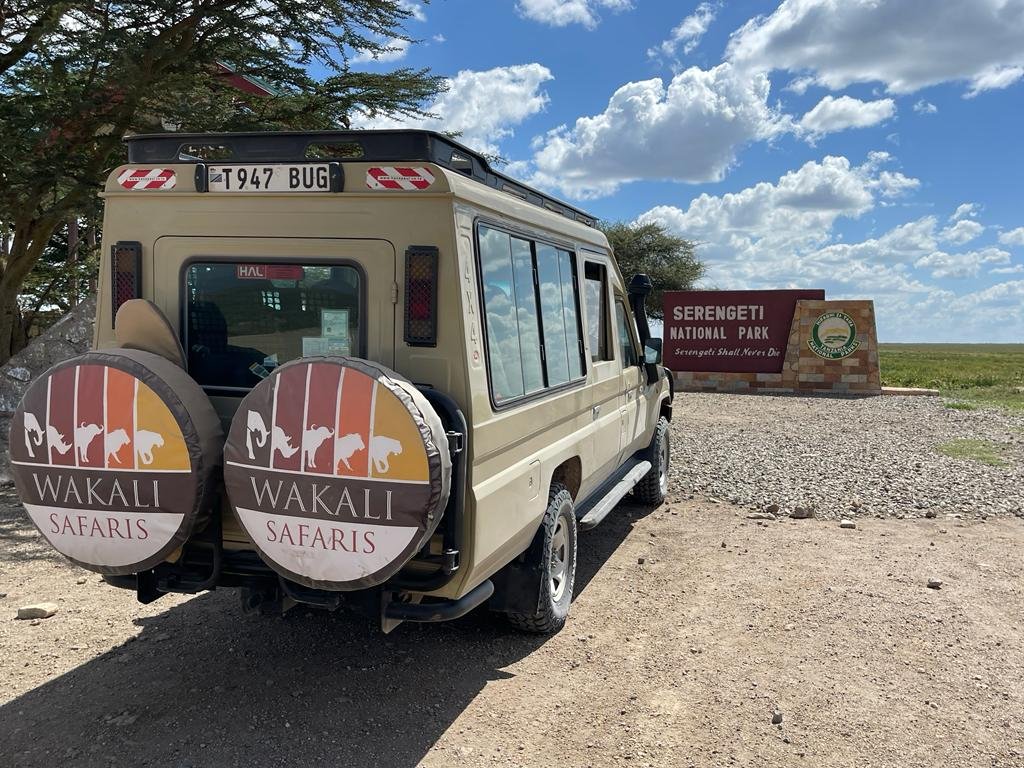 Wakali Safaris guide with guests on a safari game drive in Tanzania