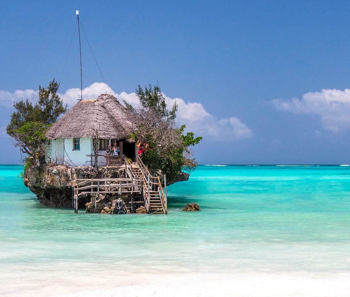 Pristine white sand beach and turquoise waters of Zanzibar island