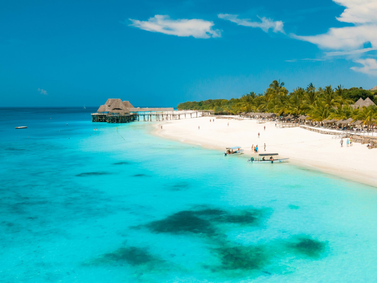 Turquoise waters and white sand beach along the coast of Zanzibar island